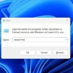 Giao diện hộp thoại Run đang nhập lệnh secpol.msc để mở Local Security Policy trên Windows.