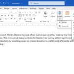 Giao diện Microsoft Word với tính năng Đọc chính tả (Dictate) được bật trên thanh Ribbon, hiển thị biểu tượng micro