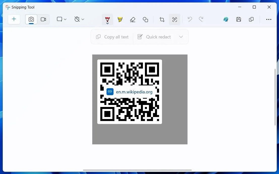 Giao diện ứng dụng Snipping Tool trên Windows 11 đang quét mã QR, hiển thị biểu tượng tác vụ văn bản
