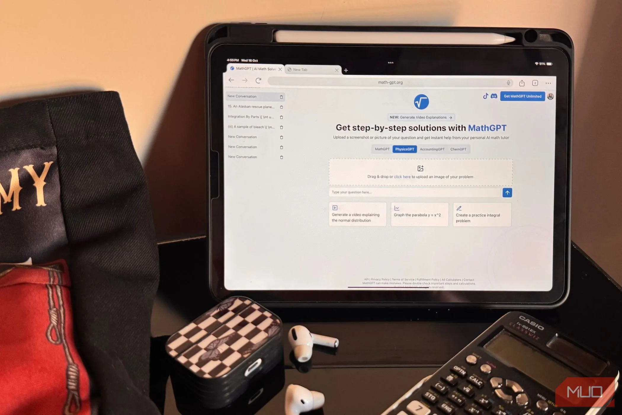 iPad hiển thị trang web MathGPT cùng với tai nghe AirPods, máy tính Casio và túi vải trên bàn