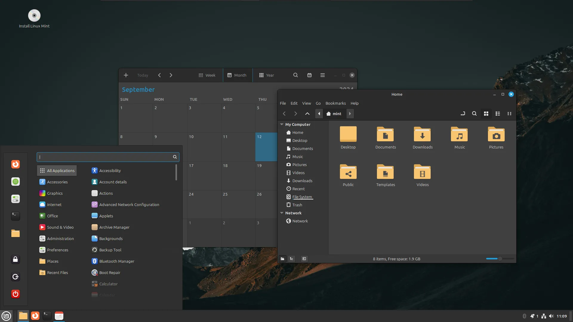 Màn hình máy tính với giao diện Linux Mint có ứng dụng lịch và trình duyệt tệp đang mở