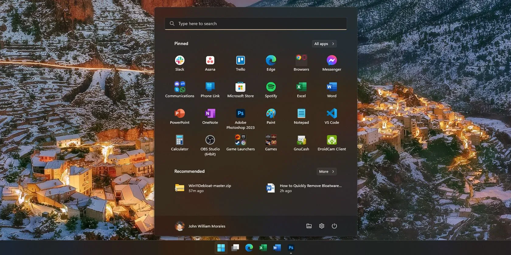 Màn hình Start Menu Windows 11 hiển thị nhiều ứng dụng được cài đặt sẵn, biểu tượng cho bloatware.