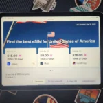 Trang web eSIM hiển thị trên iPad cùng vali du lịch, minh họa sự tiện lợi khi sử dụng eSIM khi đi công tác hoặc du lịch quốc tế.